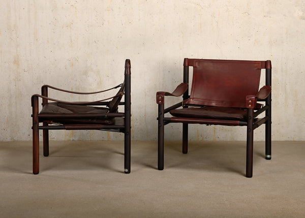 Arne Norell pair Sirocco Safari Chairs in Rosewood and Chocolate leather