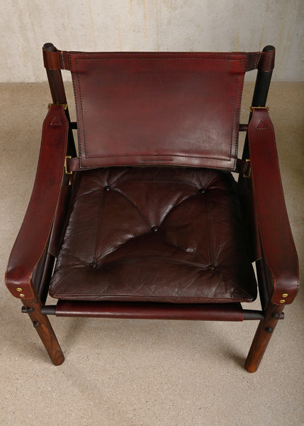 Arne Norell pair Sirocco Safari Chairs in Rosewood and Chocolate leather